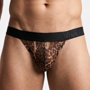 Man wearing a leopard-print sheer thong with a black elastic waistband visible at the hips.