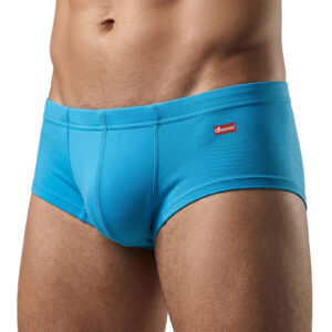 Blue men's swim briefs with a small red Groovin logo on the hip, close-up waist and upper thigh view.